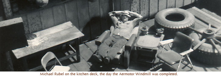 Michael Rubel on the kitchen deck, the day the Aermotor Windmill was completed. 1971.